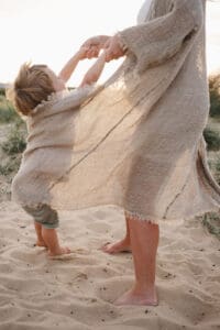 toddler playing with mum during maternity session