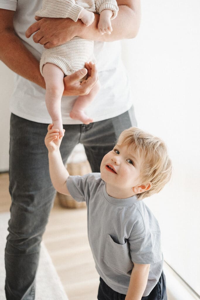 toddler in newborn photos